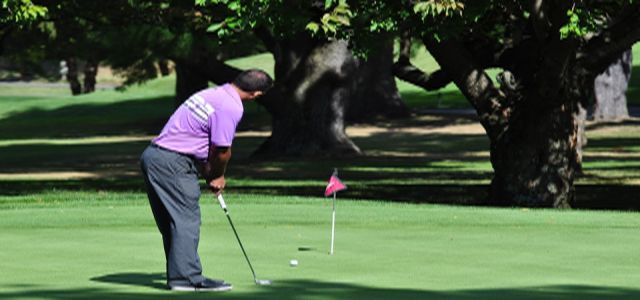 man playing golf on golf course